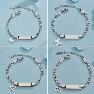 Detail view of silver stainless steel bracelets with heart, butterfly, and crown charms