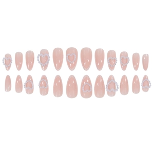 Pink almond press-on nails with white French tips and 3D pearl heart decorations