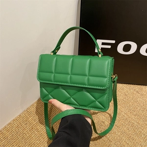 Chic green quilted faux leather crossbody bag with top handle and gold-tone hardware