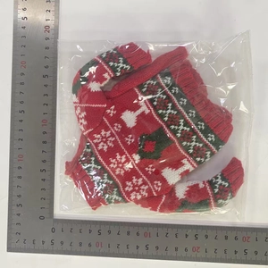 Detail view of mini knit Christmas wine bottle cover measuring 14x15cm with elk pattern
