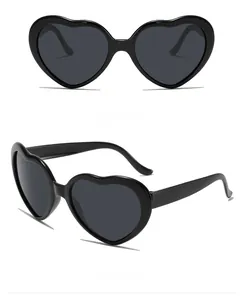 Front and 45-degree side views of black oversized heart-shaped fashion sunglasses
