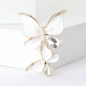 Elegant white enamel and gold double butterfly brooch set with sparkling crystals