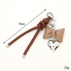 Fashion PU leather bow keychain with silver heart charm and star clasp, 15cm length
