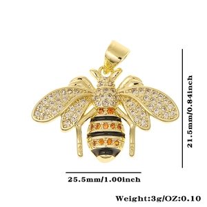 Detail showing dimensions and weight of a golden bee pendant with crystal wings