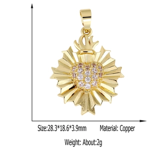 Detail view of a gold sacred heart pendant with white and pink zircon, size 28.3x18.6mm