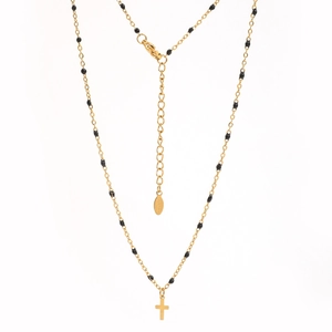 Detail of gold stainless steel necklace with black beads, cross pendant and S.Steel tag