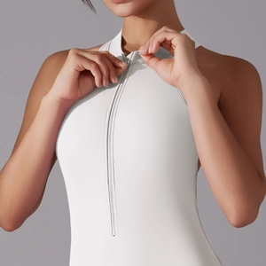 Close-up of high-neck sleeveless yoga bodysuit with invisible front zipper detail