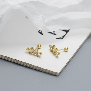 Detailed view of gold s925 silver stud earrings with zirconia stones and screw ball backs