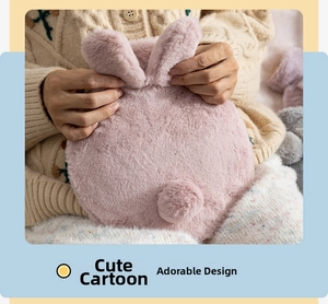 Detailed view of a soft pink rabbit plush hot water bottle cover being held in hands