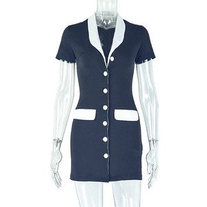 Detail of navy slim fit mini dress featuring contrast white collar and button closure