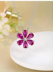 Close-up of S925 sterling silver necklace featuring a purple floral gemstone pendant