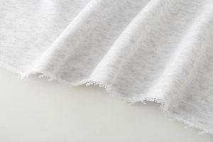 Close-up of the grey knit fabric detail showing the raw hem and soft cotton blend texture