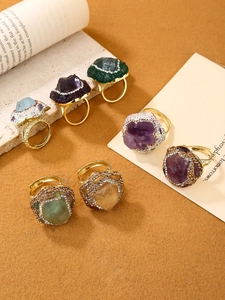 Detail of assorted irregular natural gemstone cocktail rings with sparkling crystal pavé