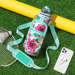 Detailed view of insulated water bottle carrier with floral pattern on green grass