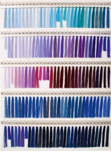 Detailed color chart of embroidered thread bundles with vintage bohemian style palette