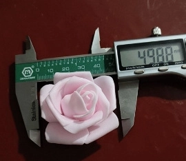 Detail showing pink foam rose head with a diameter of approximately 5cm for LED string lights