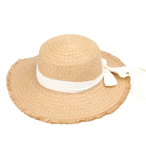 Summer straw sun hat with wide fringe brim and ivory ribbon bow decoration