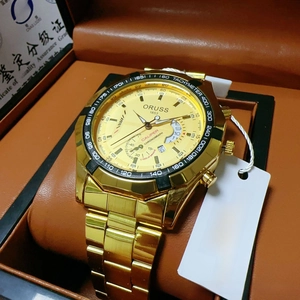 Detail of ORUSS men's gold chronograph watch with stainless steel band and luxury box