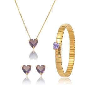 Detailed set of gold necklace, heart-shaped purple zirconia earrings, and bracelet