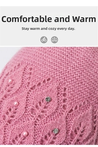Close-up of pink knitted winter hat featuring hollow patterns, pearls and rhinestones