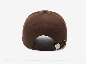Detail view of the brown baseball cap back with adjustable silver metal buckle and strap