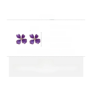 Detailed view of purple floral earrings with pearls and silver posts and size measurements