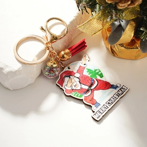 Creative Christmas keychain featuring a dabbing Santa Claus, red tassel, and star sequin ball
