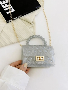 Quilted glitter PVC jelly bag with pearl handle and gold chain strap shown being held