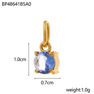 Macro detail of a square gold pendant with a blue gemstone and precise dimensions