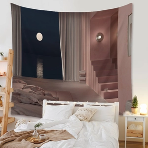 Detail of bohemian wall tapestry with minimalist ocean and moon landscape in a bedroom