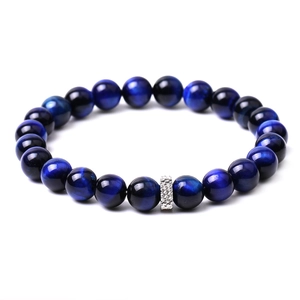 Detailed view of blue tiger eye beaded bracelet with silver geometric metal spacer bead