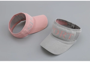 Detailed close-up of knitted sun visor fabric texture and SPORT embroidered lettering