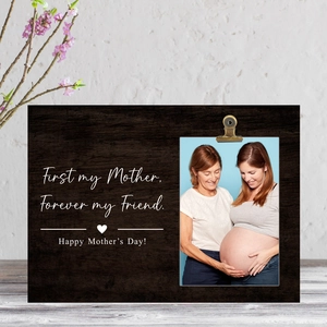 Macro view of wooden photo holder plaque with First my Mother Forever my Friend text