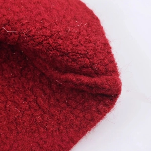 Red knit cardigan with ruffles and metallic yarn finish in high-quality detail