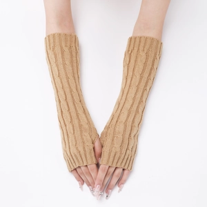 Detail of khaki cable knit fingerless gloves showing thick texture and thumb hole