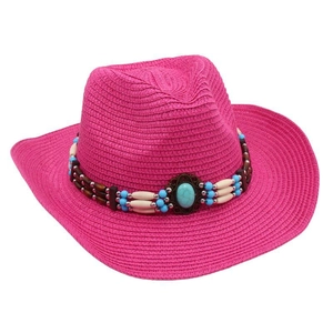 Close-up of rose red straw cowboy hat with bohemian turquoise beaded band detail
