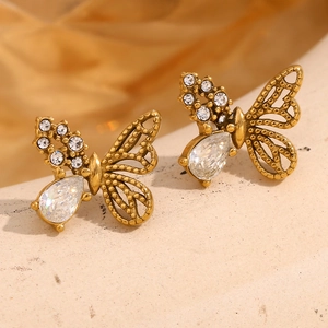 Macro shot of 18K gold plated butterfly earrings with sparkling cubic zirconia stones