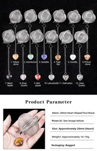 Detail view of 20mm heart-shaped stainless steel tea infuser with various gemstone charms