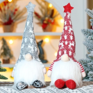 Detail of Christmas gnomes with soft red and grey knit hats and fluffy white faux fur beards