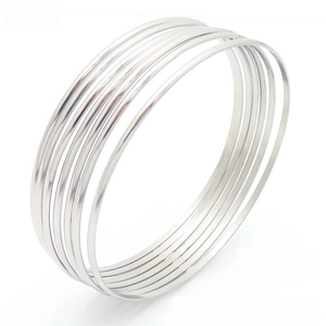 Minimalist silver multi-layer stackable round wire bangles in polished stainless steel