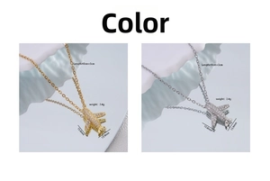 Detailed view of 18K gold and silver airplane necklaces with sparkling zircon inlay