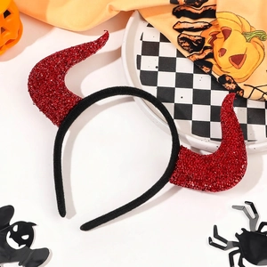 Macro shot of Halloween devil horn headband with red sequins on a festive background
