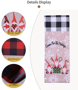 Detail of Christmas gnome wine bag with bell, whiskers, and black plaid drawstring