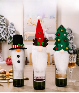 Detailed view of Christmas wine bottle covers with gnome beard, antlers and tree designs