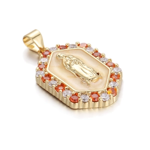 Detail view of gold Virgin Mary pendant with orange and white zircons and enamel inlay