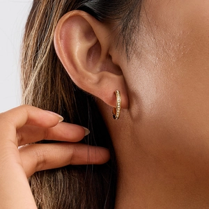 Classic 18K gold plated stainless steel wave earrings with pavé diamonds on model