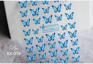 Close-up of 5D blue gradient butterfly nail art stickers with Fingertip Butterfly logo