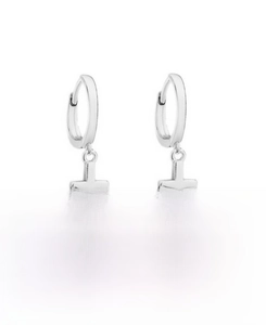 Macro detail of S925 sterling silver geometric cross hoop earrings with polished finish