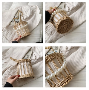 Detail shot of cylindrical straw woven bag with pearl handle and golden chain strap