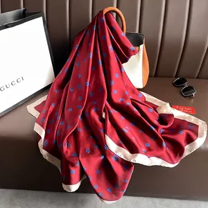 Elegant burgundy satin silk scarf with blue camellia floral prints and cream borders